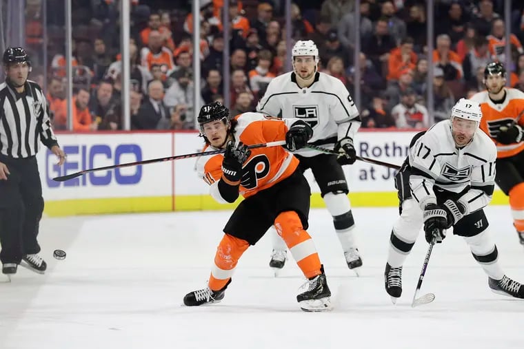 Ilya Kovalchuk (right) trying to defend against the Flyers' Travis Konecny during a game against Los Angeles last season.