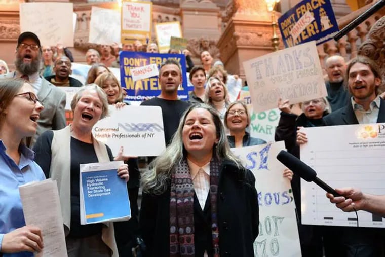 Singer Natalie Merchant leads fracking foes in a rendition of "This Land is Your Land" at the Capitol in Albany to thank officials for limiting the practice.