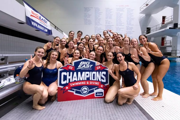 Villanova's swimming and diving team poses for its 11th consecutive Big East title at the Indiana University Natatorium in Indianapolis earlier this year.