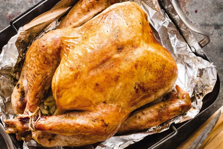This undated photo provided by America's Test Kitchen in October 2018 shows a roast turkey in Brookline, Mass. This recipe appears in the cookbook "ATB Holiday Entertaining."
