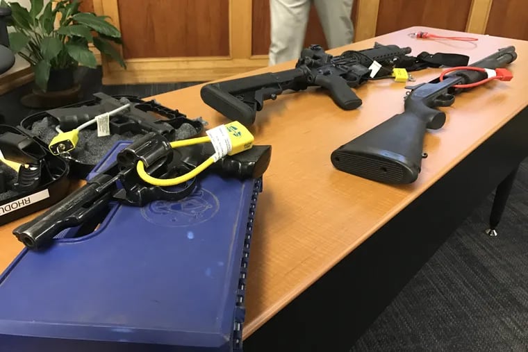 Firearms secured with safety locks, which can keep children or at-risk people from accessing guns, at an April 2017 news conference with Bucks County District Attorney Matthew Weintraub.
