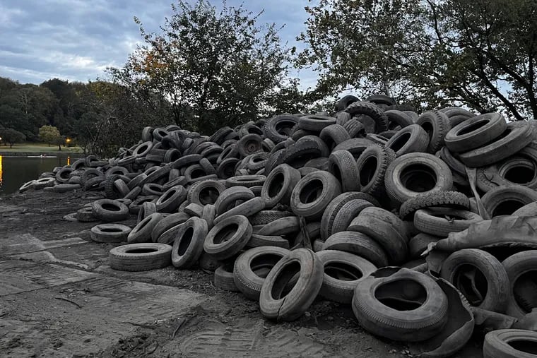 Some of the more than 3,000 tires that have been pulled out of the Schuylkill in Philadelphia as part of a dredge of the racecourse for rowers. This pile was started just downriver of the Columbia Bridge.