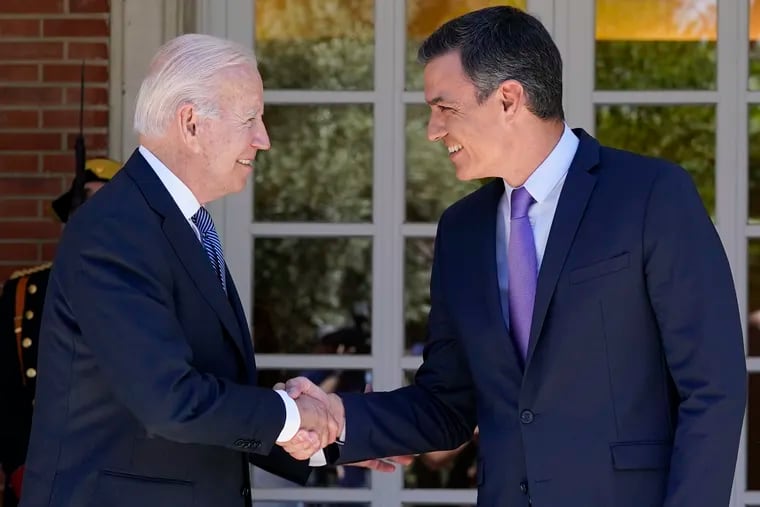 President Joe Biden and Spain's Prime Minister Pedro Sánchez (right) shake hands as they meet at the Palace of Moncloa in Madrid.