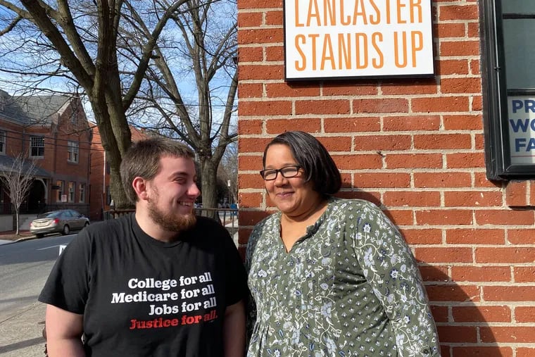 Organizers Zak Gregg and Eliza Booth outside of the Lancaster Stands Up office in Lancaster, Pa. The progressive group, like Reclaim Philadelphia, was largely formed by supporters of Bernie Sanders's 2016 campaign.