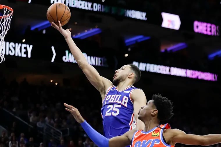 Sixers guard Ben Simmons lays up the basketball past Thunder guard Shai Gilgeous-Alexander during the second half.