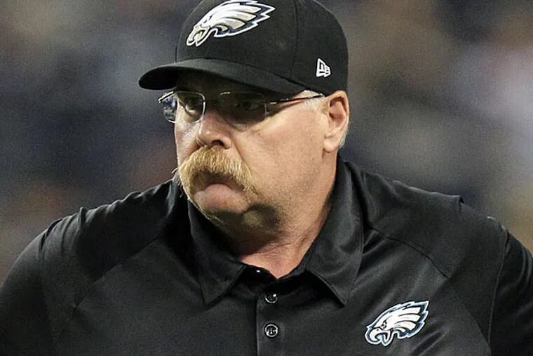 Philadelphia Eagles head coach Andy Reid watches his team on the field
before an NFL football game against the Dallas Cowboys, Sunday, Dec.
2, 2012, in Arlington, Texas. (AP Photo/LM Otero)
