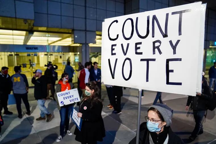 DETROIT, MI - NOVEMBER 04: Detroit Will Breathe supporter Betsy Camaredo of Hazel Park holds a sign that says "Count Every Vote" outside of the Detroit Department of Elections Central Counting Board of Voting absentee ballot counting center at TCF Center, Wednesday, Nov. 4, 2020 in Detroit, MI. With the surge in vote by mail/absentee ballots, analysts cautioned it could take days to count all the ballots, leading some states to initially look like victories for President Trump only to later shift towards democratic Presidential candidate Joe Biden. (Kent Nishimura/Los Angeles Times/TNS)