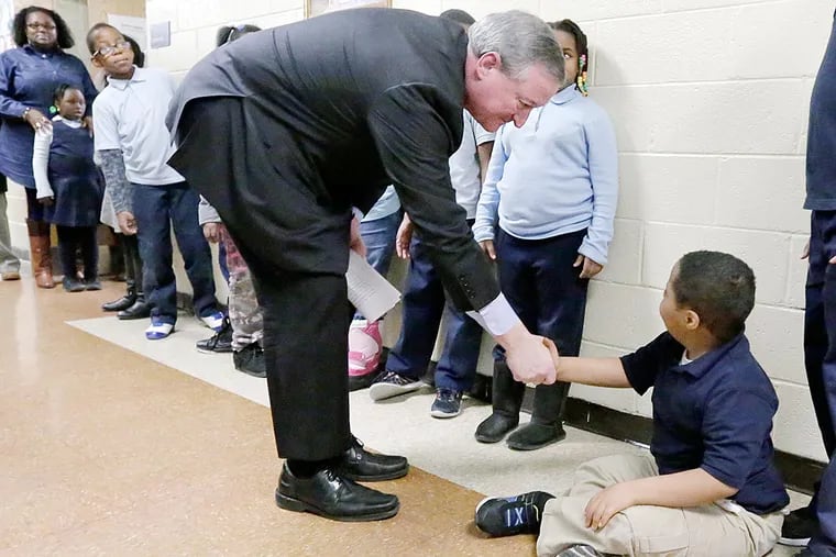 Mayor Kenney meets a student who grew tired of standing at Penrose Elementary in Southwest Philadelphia. on Friday.  Kenney pledged to visit one school a week; he made his first stop at Penrose.