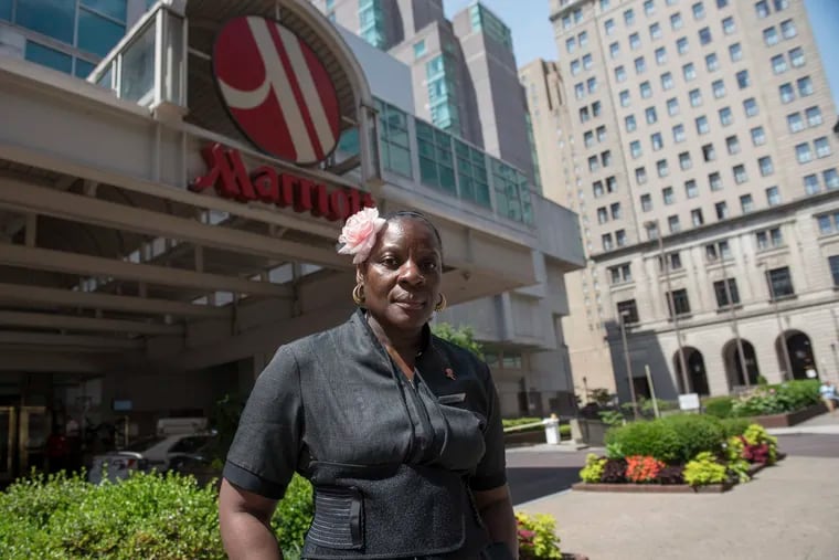 Katherine Payne, a housekeeper at the Philadelphia Marriott Downtown, poses for a portrait on Tuesday, June 26, 2018. The hotel, which is the largest in the city, says its new tech tool to schedule and manage their housekeepers on-demand has improved productivity and saved on "time and labor expense." But housekeepers say the tool has actually made their job harder and more time-consuming by taking away the control they had over their schedule.