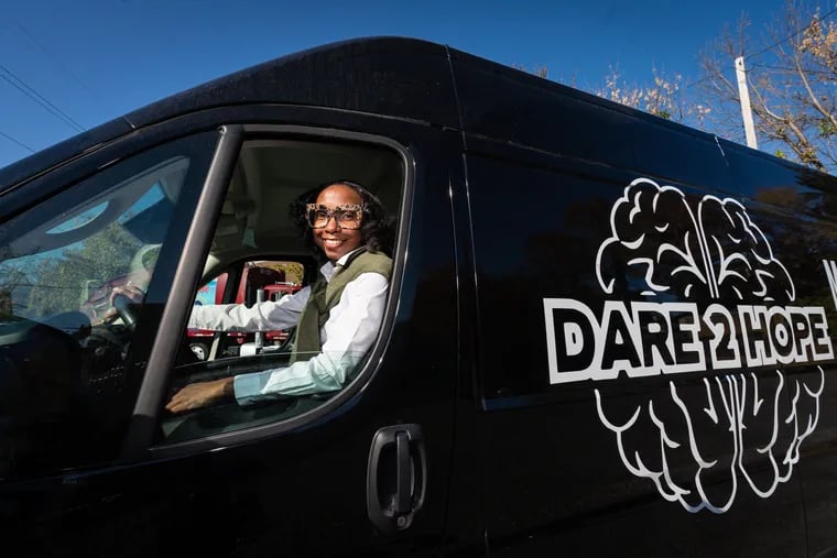 Sarah-Ashley Andrews, the youngest member of the Philadelphia school board, a therapist and a pastor, in her recently purchased mobile therapy van, in Philadelphia.