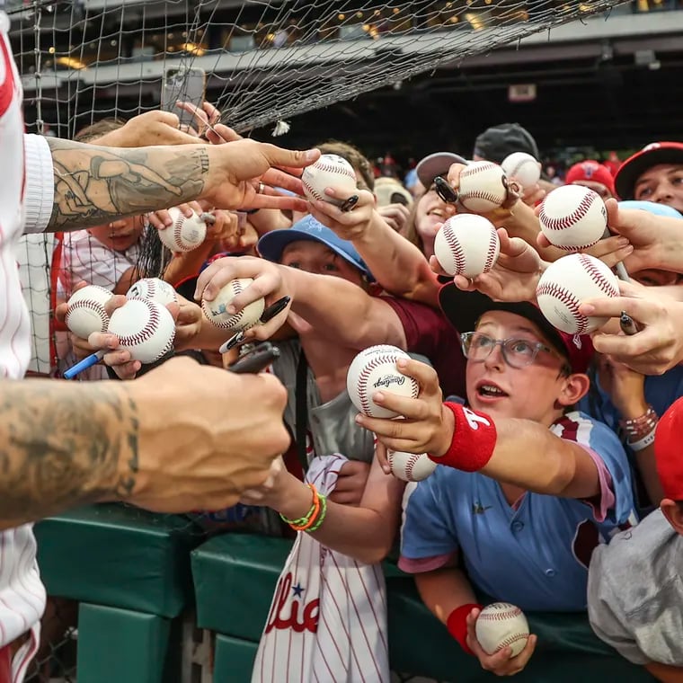 Fans clamor for an autograph from Phillies right fielder Nick Castellanos before the start of a game against the Los Angeles Angels at Citizens Bank Park.