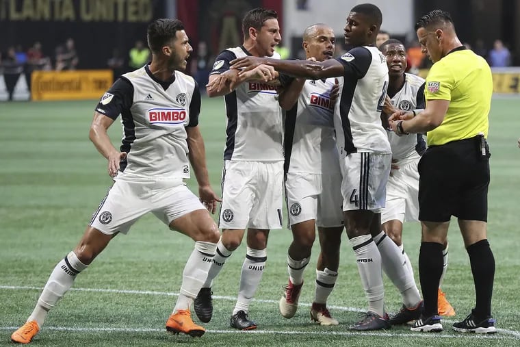 Referee Sorin Stoica (right) sent off Alejandro Bedoya and Haris Medunjanin within seconds of each other in the Philadelphia Union's loss at Atlanta United. 