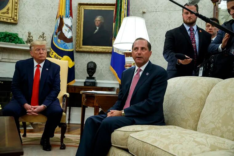 President Donald Trump listens as Secretary of Health and Human Services Alex Azar talks about a plan to ban most flavored e-cigarettes, in the Oval Office of the White House, Wednesday, Sept. 11, 2019, in Washington. (AP Photo/Evan Vucci)
