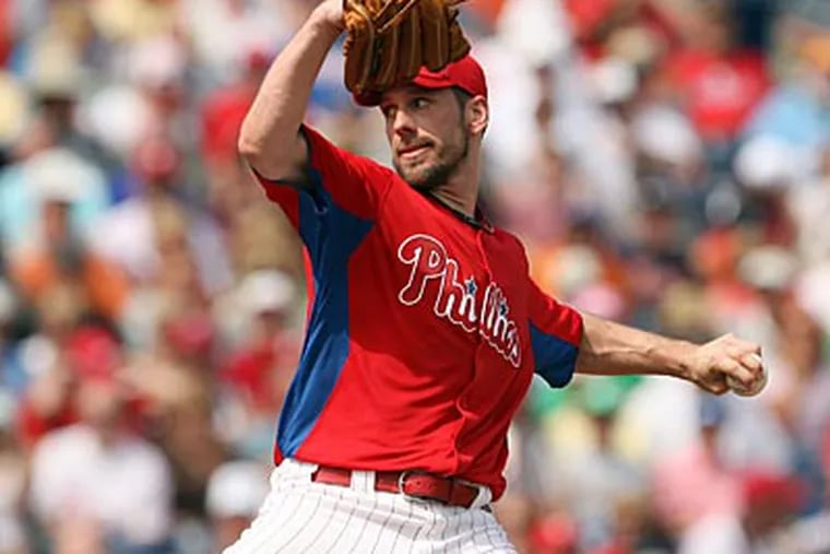 Cliff Lee's return to the Phillies has them as the prohibitive favorites to win the National League. (Yong Kim/Staff Photographer)