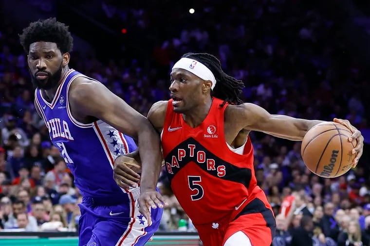 Toronto Raptors forward Precious Achiuwa drives to the basket against Sixers center Joel Embiid during game five of the first-round Eastern Conference playoffs on Monday, April 25, 2022 in Philadelphia.