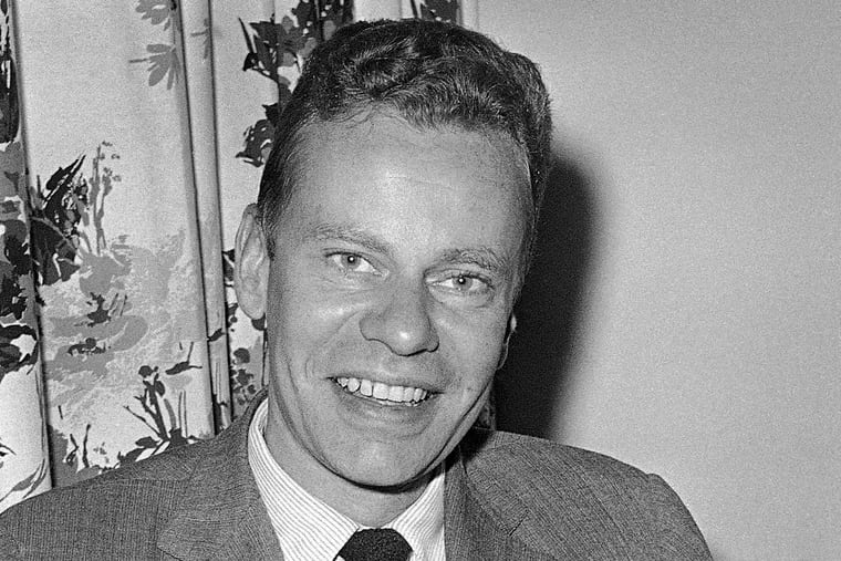 FILE - This Oct. 14, 1959 file photo shows Charles Van Doren at New York's Hotel Roosevelt. Van Doren, who admitted his television quiz show performances in the 1950s had been rigged, died on Tuesday, April 9, 2019, in Canaan, Conn. He was 93. (AP Photo)