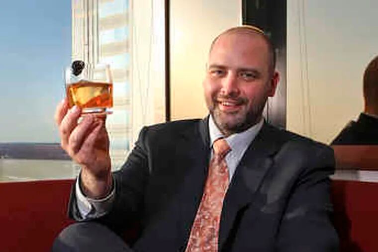 R2L's Ryan Davis (above) exhibits a perfectly iced Manhattan. Two other R2L concoctions (left) enjoy the view.