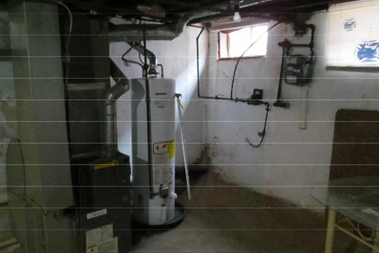 A bid document described extensive work in the basement of the house that includes installing a new furnace and re-installing the existing hot water heater, seen here in a photo found online of 428 Daly St. Emergency officials said they believe a worker was working on a water heater when the blast occurred.