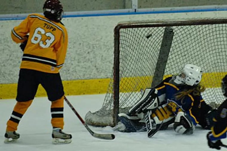 Unionville's Molly Tupp scores the winning goal in the third period over Down. East goalie Miranda Stueve. (Ron Tarver/Staff Photographer)