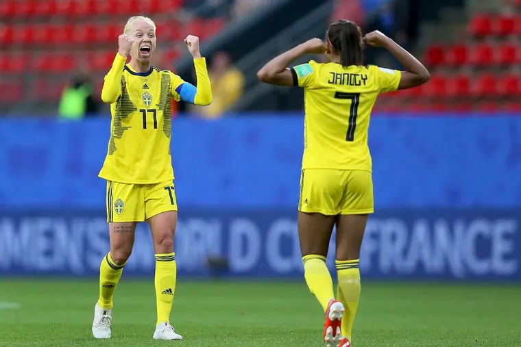 Sweden's Stina Blackstenius (left) and Madelen Janogy (right) celebrate after the final whistle of their win over Sweden at the Women's World Cup.