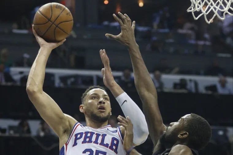 Ben Simmons shoots against Hornets forward Michael Kidd-Gilchrist in the second half.