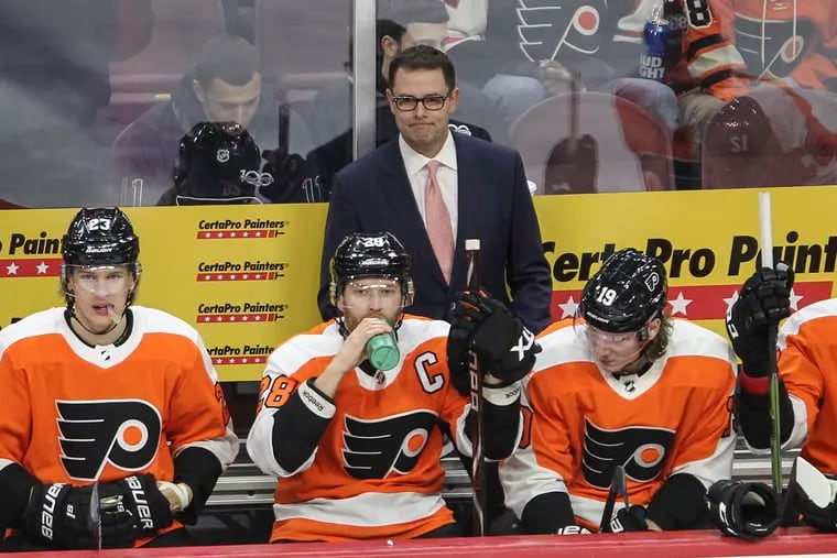 Flyers' interim Head Coach Scott Gordon watches his team warp against the Red Wings before the first period of at the Wells Fargo Center, Tuesday,  December 18, 2018.  STEVEN M. FALK  / Staff Photographer