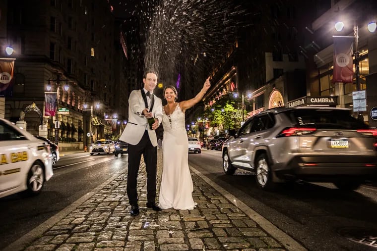 Mike and Kelly celebrating their marriage on Broad Street.