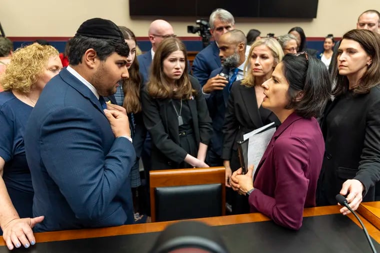 Kobie Talmoud, 16, (left), a student at John F. Kennedy High School in Silver Spring, Md., speaks with Karla Silvestre, president of the Board of Education in Montgomery County, Md., after a congressional hearing on antisemitism in K-12 public schools. Three teachers in Silvestre's school district filed a lawsuit after being suspended for expressing pro-Palestinian views.