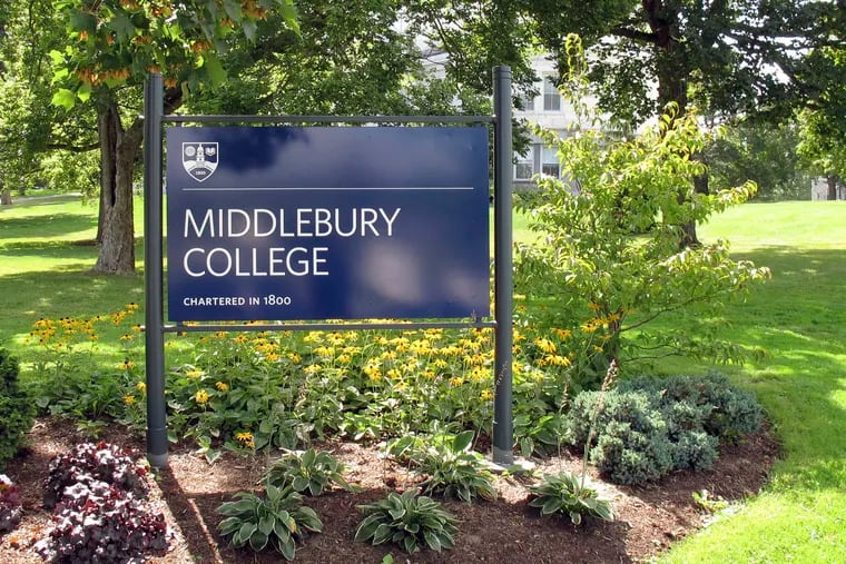FILE - This Aug. 31, 2017, file photo, shows a sign for Middlebury College on the campus in Middlebury, Vt. A Middlebury College chemistry professor whose written exam question asked students to calculate the lethal dose of a poisonous gas used in Nazi gas chambers during the Holocaust has taken a leave of absence, the school said. (AP Photo/Wilson Ring, File)