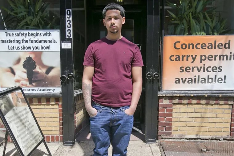 Emmanuel Hernandez , shown at the Philly Firearms Academy on Spring Garden Street, wants to apply for a concealed-carry permit at some point: He represents the demographic targeted in the "Black Guns Matter" campaign.