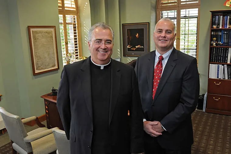 At Villanova University, the Rev. Peter M. Donohue (left), president of the institution, with Michael J. O'Neill, vice president for university advancement. (April Saul/Staff)