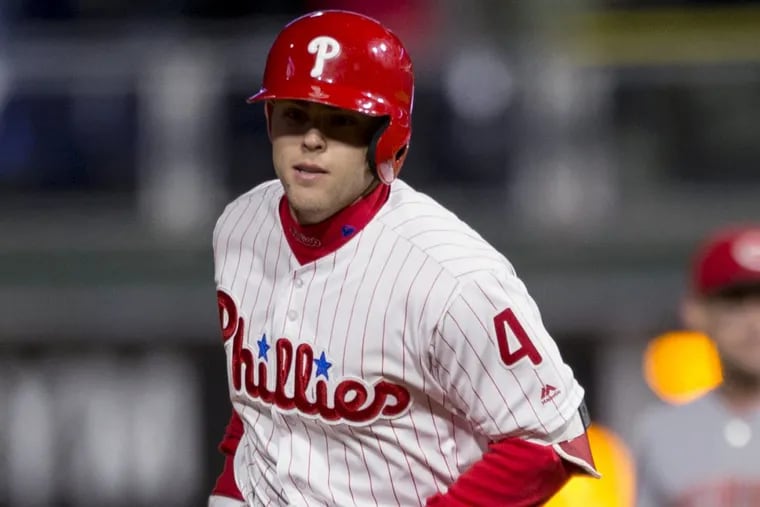Phillies rookie Scott Kingery rounds the bases after hitting his first career grand slam Tuesday against Cincinnati.