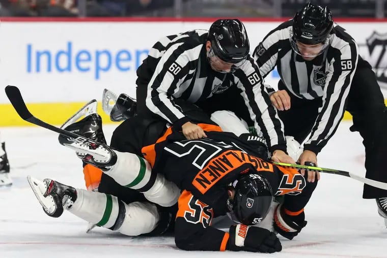 Flyers defenseman Rasmus Ristolainen gets the better of Dallas Stars center Roope Hintz during a second-period fight at the Wells Fargo Center.