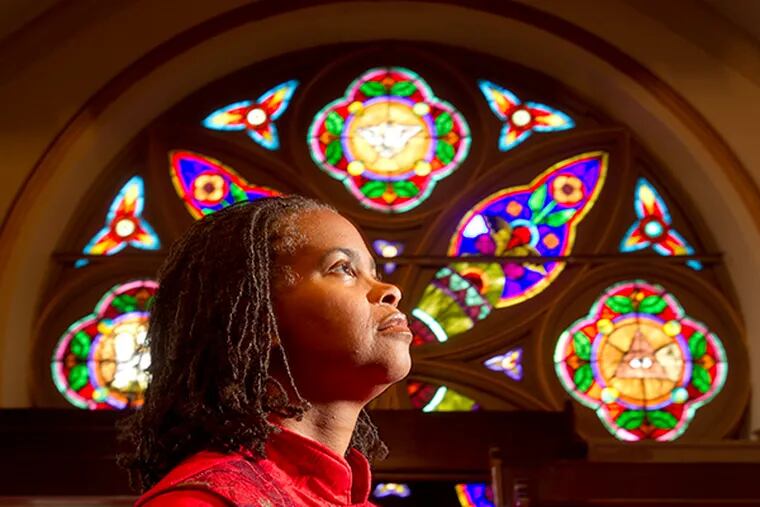 The Rev. Leslie Callahan, pastor of St. Paul's Baptist Church in North Philadelphia. A dynamic preacher with credentials from Harvard and Penn, Callahan is marking her fifth year at the church. (CHARLES FOX / Staff Photographer)
