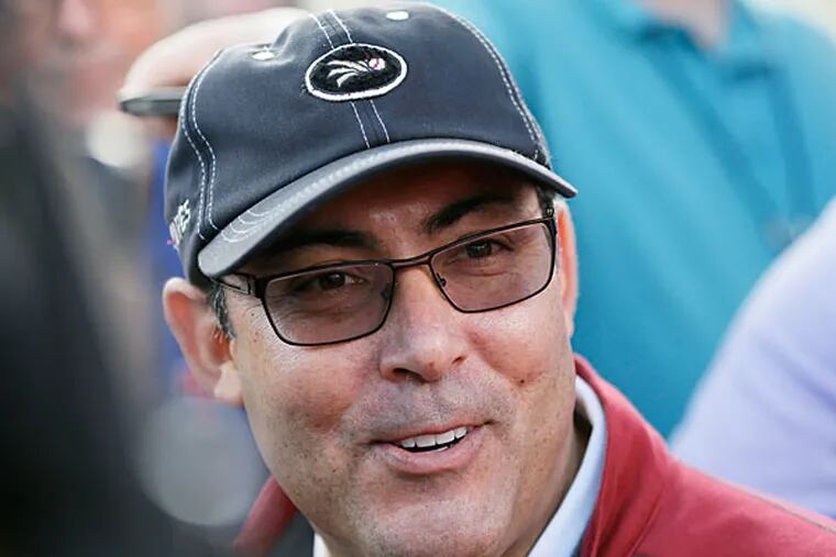 Ruben Amaro Jr. speaks to reporters before a spring training baseball practice Thursday, Feb. 13, 2014, in Clearwater, Fla. (Charlie Neibergall/AP)