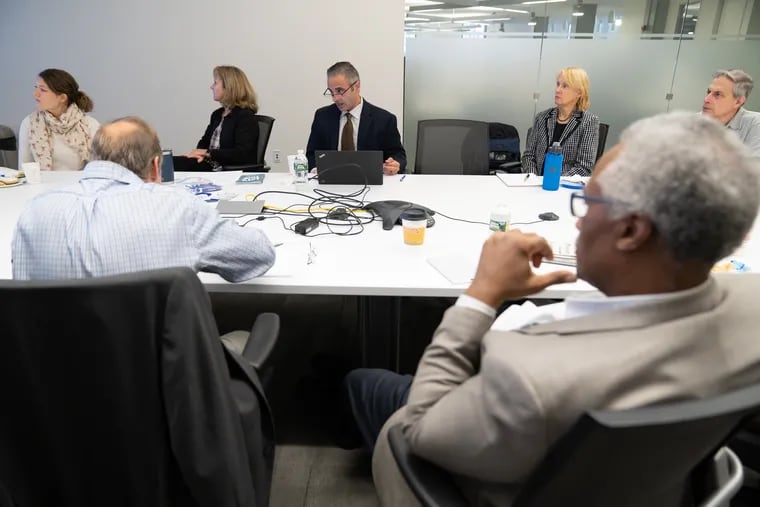 Dominic Fulginiti, back center, talks with the group at an the Table discussion about recycling, at 801 Market Street, in Philadelphia, November 08, 2018.