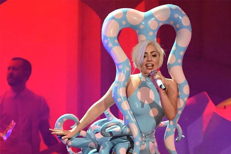 Lady Gaga becomes a blue octopus, with polka dots, in her &quot;Artpop Ball&quot; show that came to the Wells Fargo Thursday. She performed all but one of the unsubtle tracks from her &quot;Artpop&quot; album in an hour-and-40-minute show.