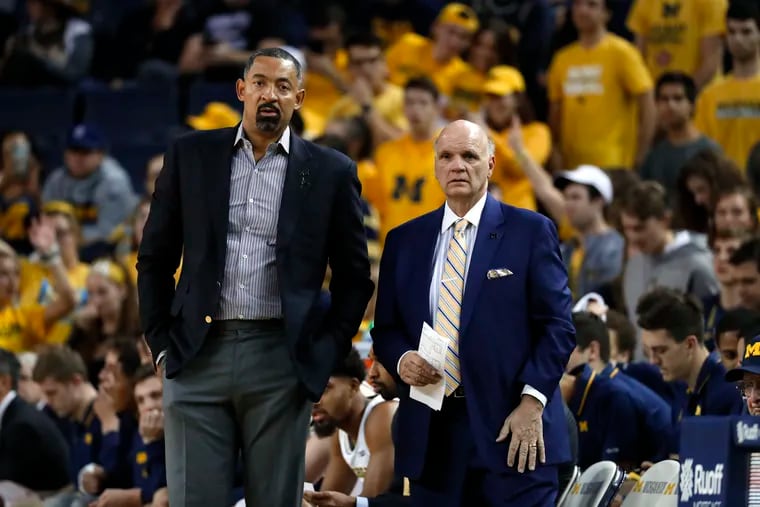 Michigan head coach Juwan Howard, left, and associate coach Phil Martelli watch against Saginaw Valley State in the first half of an NCAA exhibition college basketball game in Ann Arbor, Mich., Friday, Nov. 1, 2019. (AP Photo/Paul Sancya)