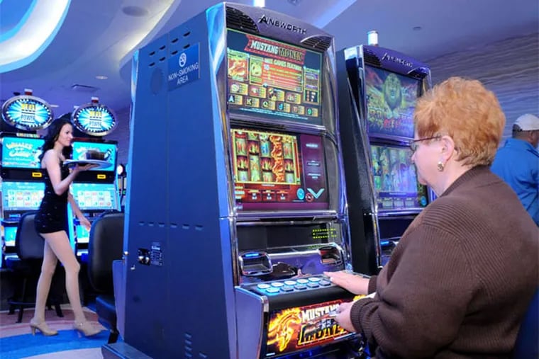 Carol Balog of Pottstown plays the slot machines at the Valley Forge Casino Resort, Pennsylvania's 11th and newest gambling hall. (Clem Murray / Staff Photographer)