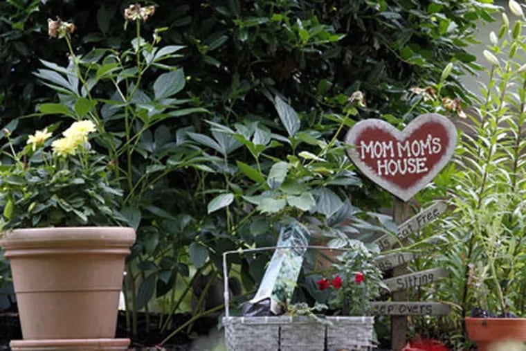 The front garden area of Suzanne Cohen's Cherry Hill home.  Police say she tried to hire an undercover cop to beat her ex-husband, son and daughter. (Yong Kim / Staff Photographer)