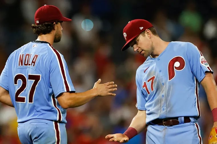 Phillies pitcher Aaron Nola and first baseman Rhys Hoskins are among 130 new free agents.