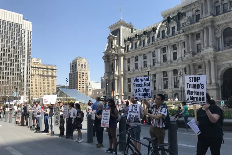 Protesters in Philadelphia demonstrate against the U.S. air strike against Syria.
