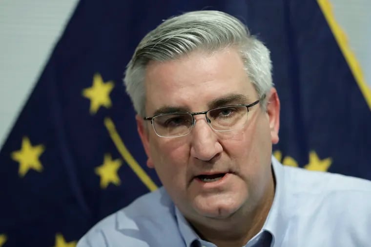 FILE - In this Dec. 6, 2018 file photo Indiana Gov. Eric Holcomb speaks about his agenda priorities for the upcoming legislative session, in Zionsville, Ind. Holcomb wants Indiana off a short list of five states that do not have a hate crimes law. But as the annual legislative session in this deeply conservative state nears, some caution that the debate could spiral into a bitter culture war. (AP Photo/Darron Cummings File)