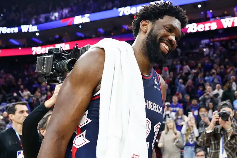 Sixers center Joel Embiid smiles after scoring 70 points against the San Antonio Spurs on Monday.