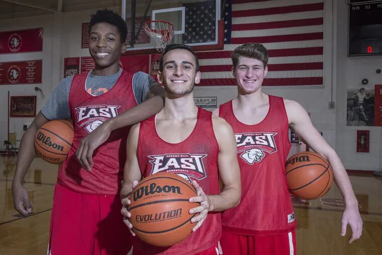 Cherry Hill East senior basketball players (from left) Dienye Peterside, Jared Ohnona and Jake Berstein all were cut from middle school team but have developed into key players for varsity.
