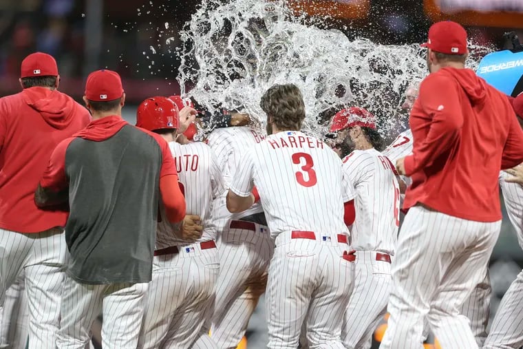 Phillies' Jay Bruce center celebrates with teammates his walk off double to beat the Mets 5-4 in 10 innings at Citizens Bank Park in Philadelphia, Wednesday, June 26, 2019