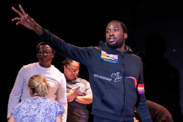 Meek Mill says his goodbyes after handing out backpacks this fall to the students at James G. Blaine Elementary School.