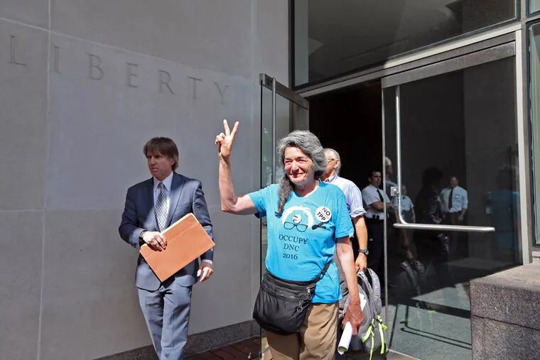 Anna Marie Stenberg, 69, climbed the high fence at the delegate entrance at the Wells Fargo Center on Tuesday. She was one of four people arrested and later released on federal charges. An attorney argues they, like others, should not be charged.