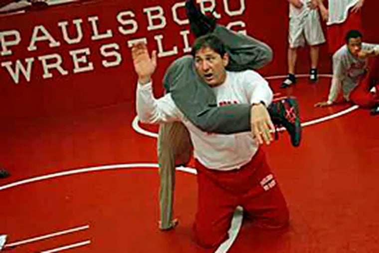 Paulsboro didn't lose a wrestling match for 37 years.  Until last week.  Principal, wrestling coach and town councilman Paul Morina told his wrestlers "you can't win forever." (Michael S. Wirtz/Inquirer)