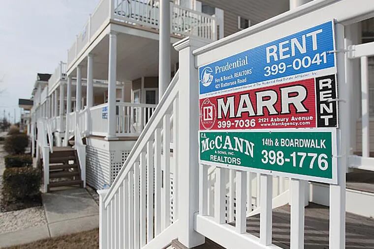 File photo: One two-story duplex on West Ave in Ocean City shows the signs of three rental properties waiting to be rented for this coming summer. ( MICHAEL BRYANT / Staff Photographer  )